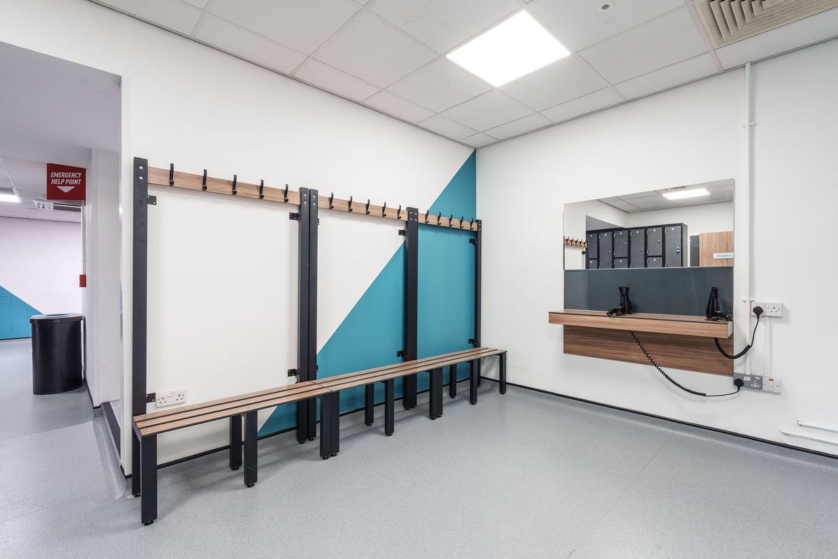 PureGym Leeds City Centre South changing room with benches and mirror