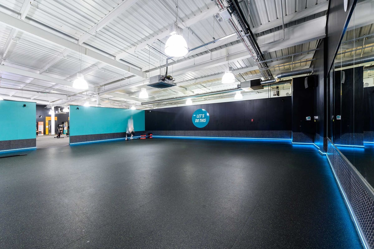 PureGym Glasgow Shawlands: Brightly-lit gym studio with a rubberised floor.