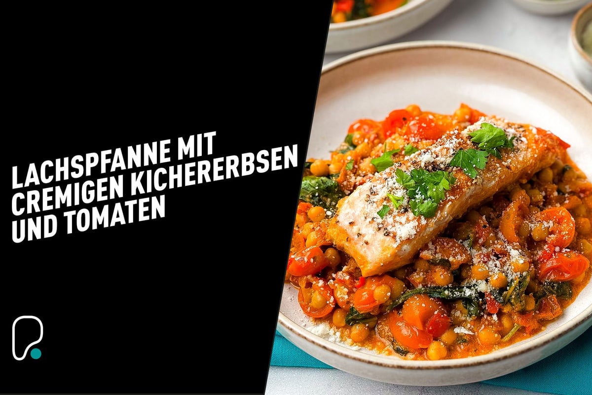 Salmon fillet on creamy chickpeas and cherry tomatoes garnished with parsley and cheese