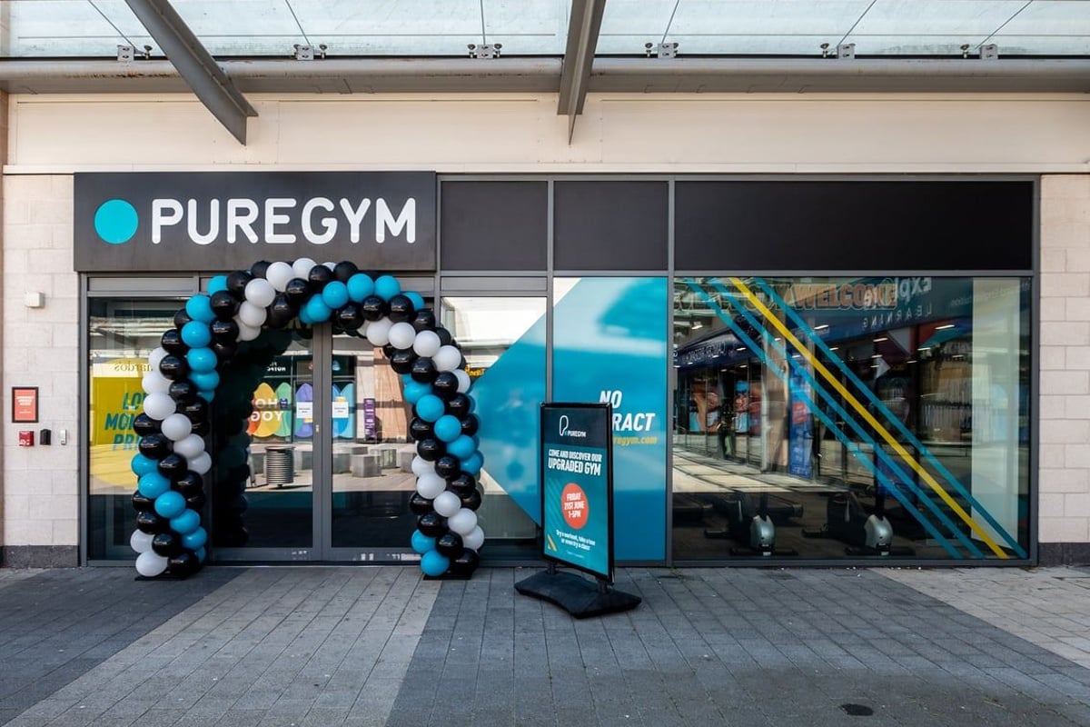 PureGym Coventry Warwickshire Shopping Park: Balloon arch outside a gym entrance with PureGym sign.