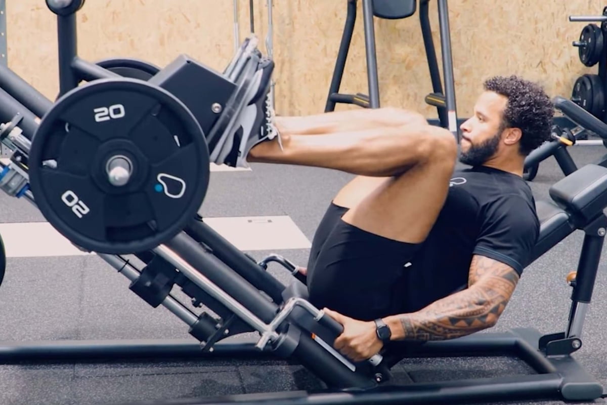 PureGym PT using the leg press