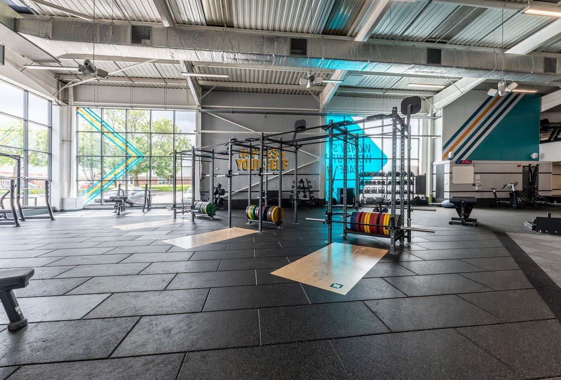 PureGym Brierley Hill: Squat racks, weight plates of various colours and other training equipment.