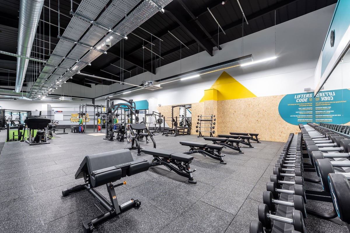 PureGym Dungannon: Resistance machines, benches, free weights, and rubberized flooring in a modern gym interior.