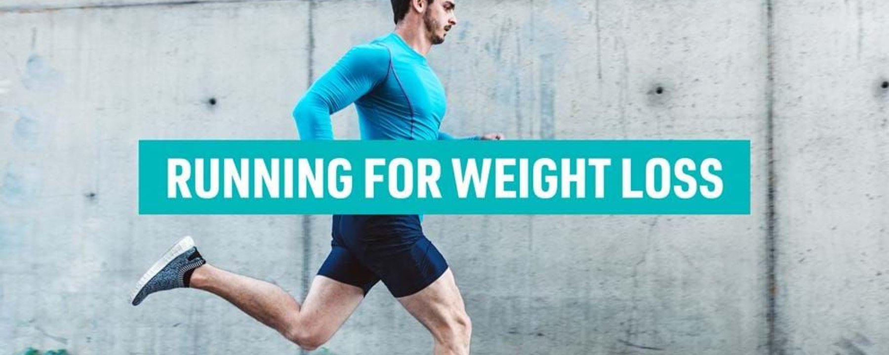 Man in blue running gear jogging past a concrete wall with text overlay.