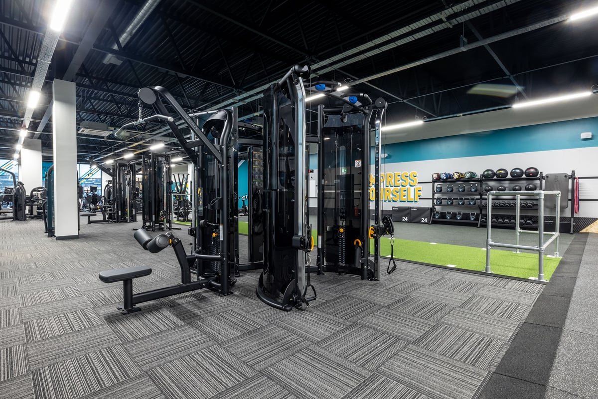PureGym Washington: Gym interior with weight machines, free weights, benches, and rubberized flooring.