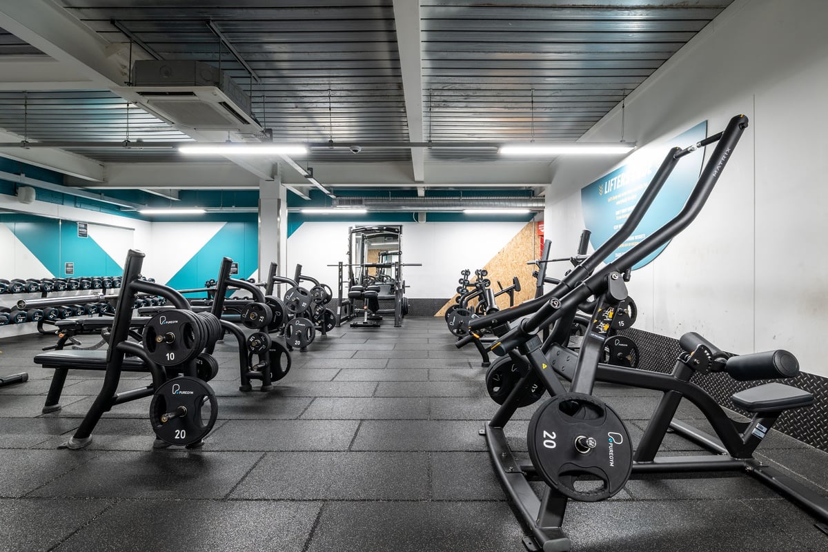 PureGym London Orpington Central: Rows of exercise bikes, ellipticals, weight racks and free weights.