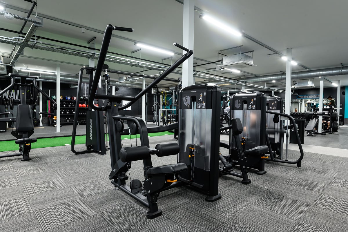 PureGym St Albans: Weight machines, cable crossovers, resistance equipment, and rubberized flooring in a modern gym.