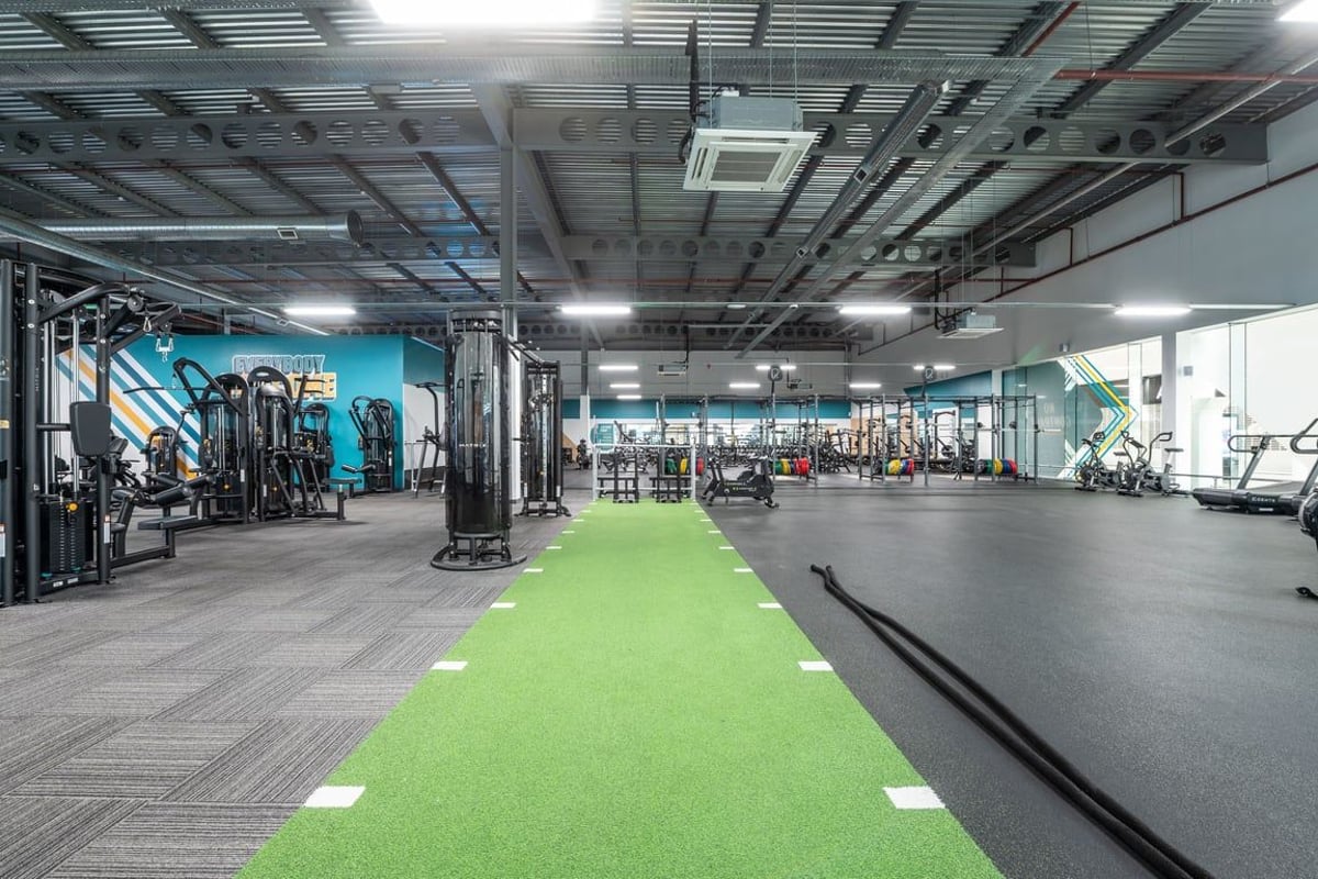 PureGym Peterborough Serpentine Green Shopping Centre: Gym with weight machines, free weights, turf area and mirrored walls.