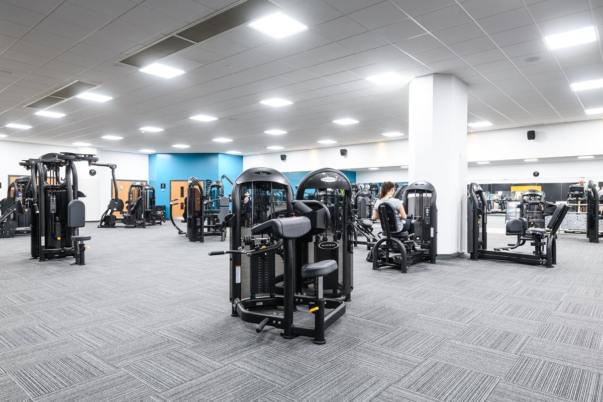 PureGym Aylesbury: Resistance machines, benches, free weights, and rubberized flooring in a brightly lit gym space.