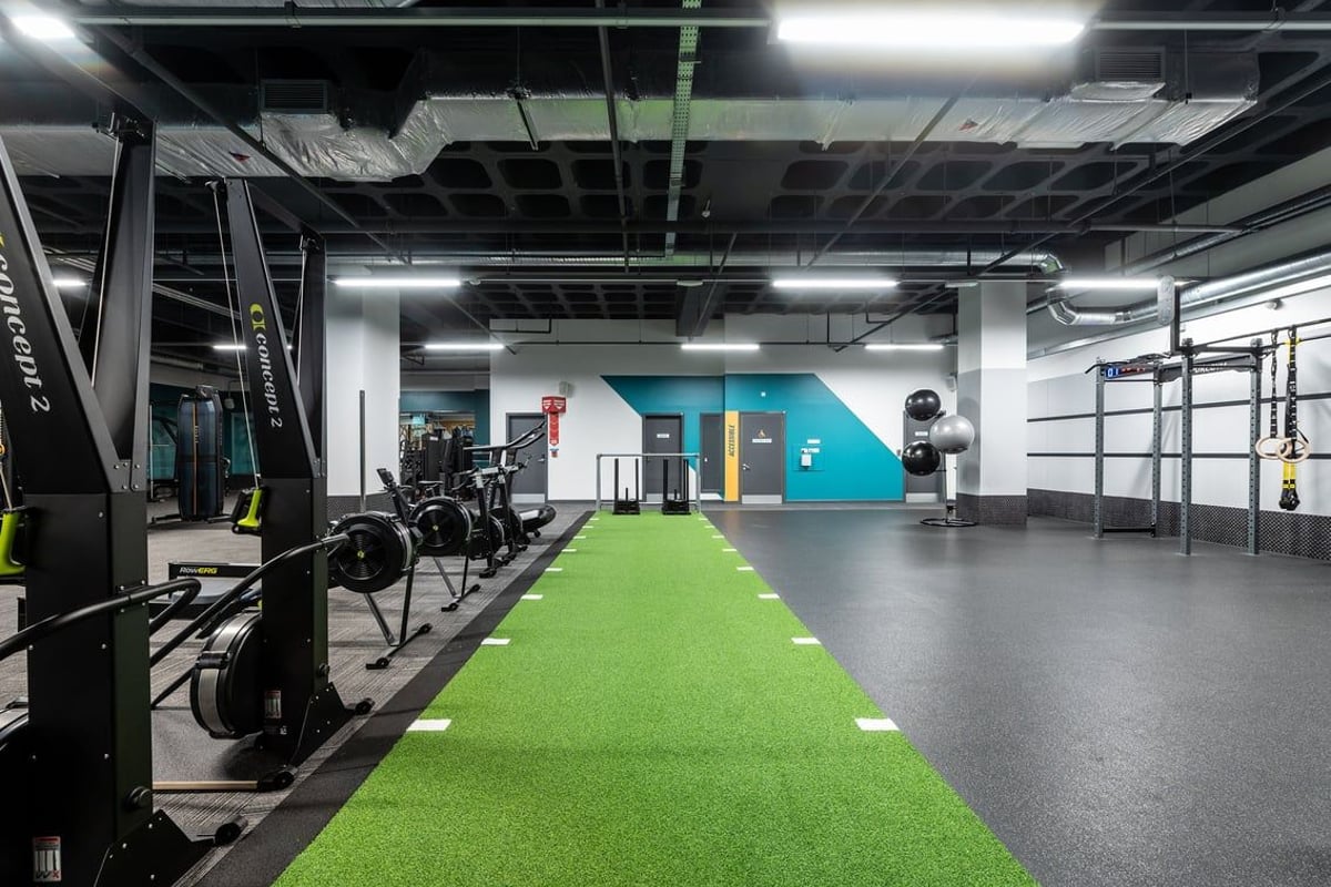 PureGym Ipswich Buttermarket: Weight racks, turf runway, climbing ropes, rubberised floors in a gym studio.
