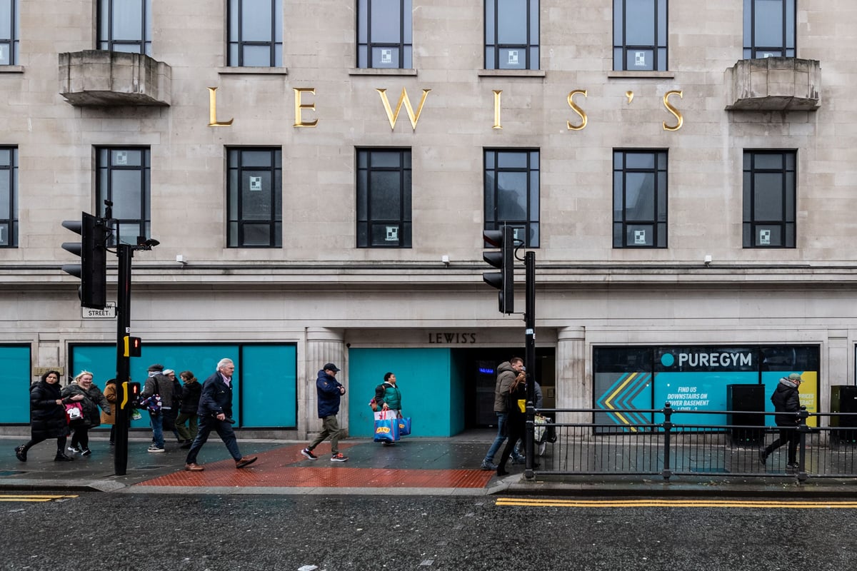 PureGym Liverpool Central: The storefront with the Lewis's sign and people walking by on the sidewalk.
