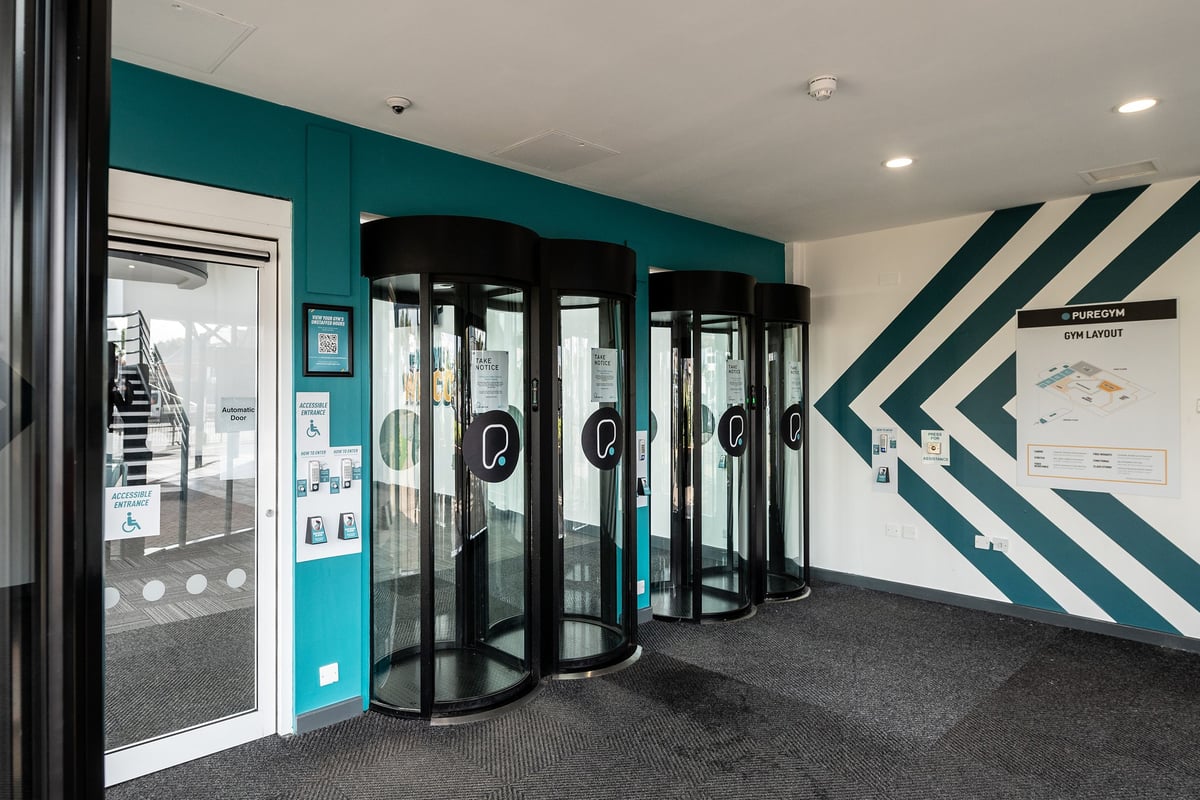 PureGym Birmingham Beaufort Park: Turnstiles and entry gates leading into a gym or fitness center.