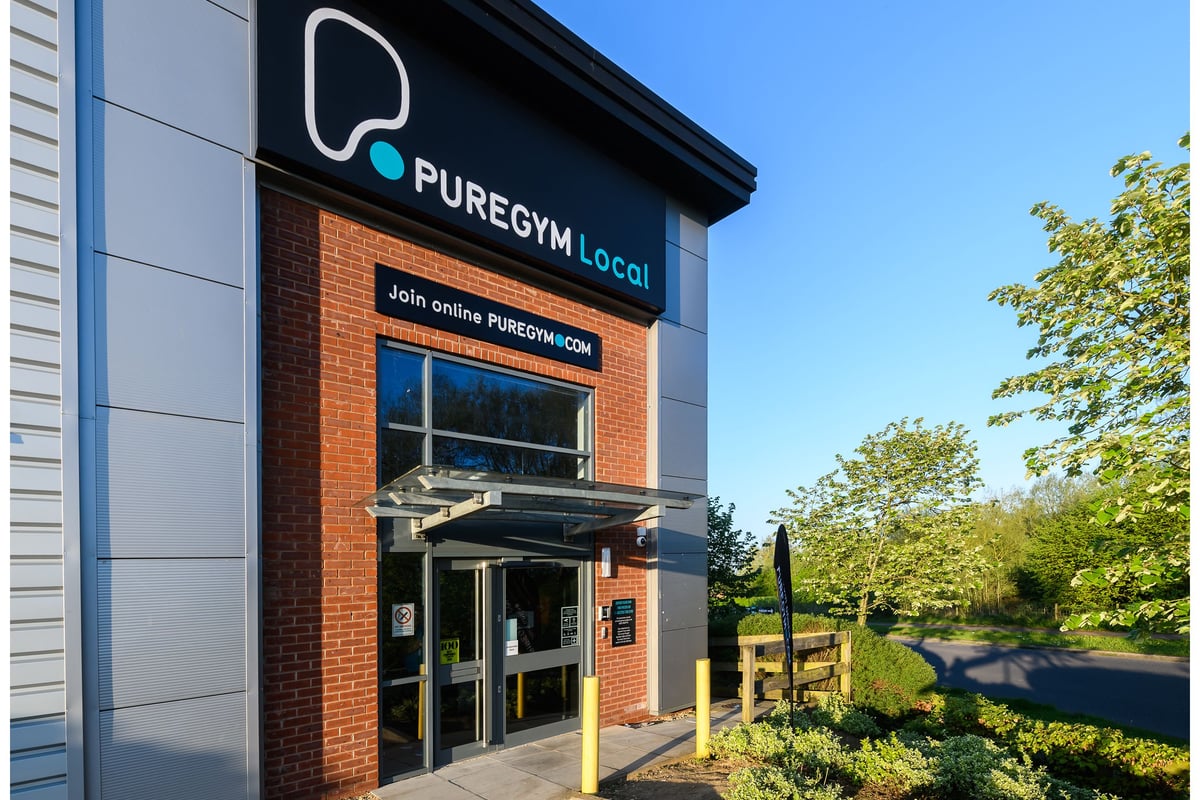 PureGym Buckingham: Exterior view of a gym building with brick facade and logo signage.