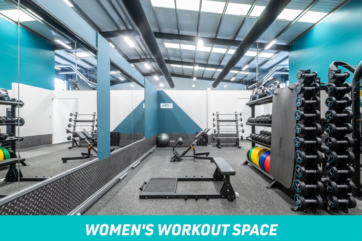 PureGym Wolverhampton South Women's Workout Space: Large mirror, functional equipment and barbells