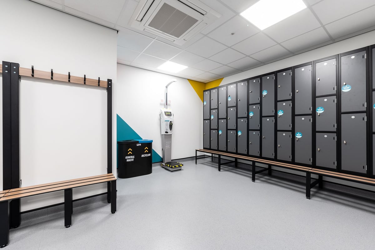 PureGym Stockton-on-tees Teesside Park: Lockers, benches, whiteboard, open space for group exercise or stretching.