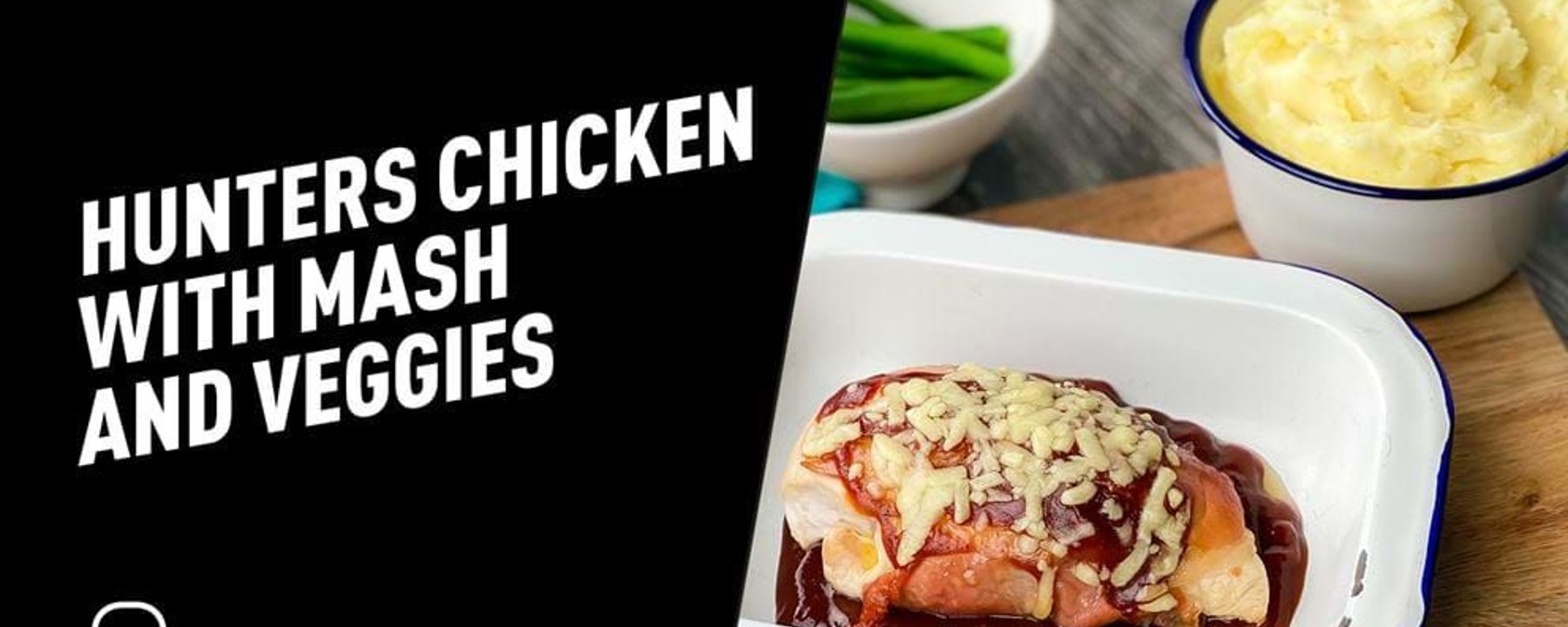 Chicken breast topped with cheese and sauce in a white dish with mash and green beans near