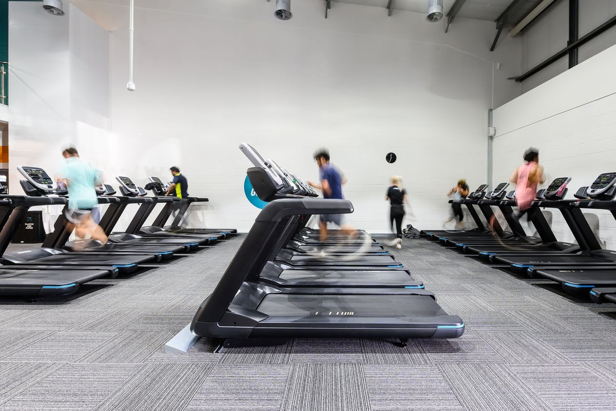 PureGym Bristol Abbey Wood Retail Park: Rows of treadmills lined up in a bright fitness studio.
