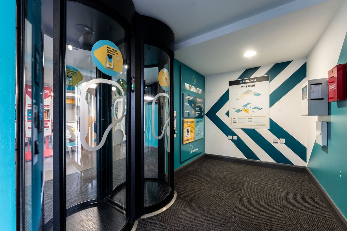 PureGym Brierley Hill: Entrance pods, teal accent walls, information displays.