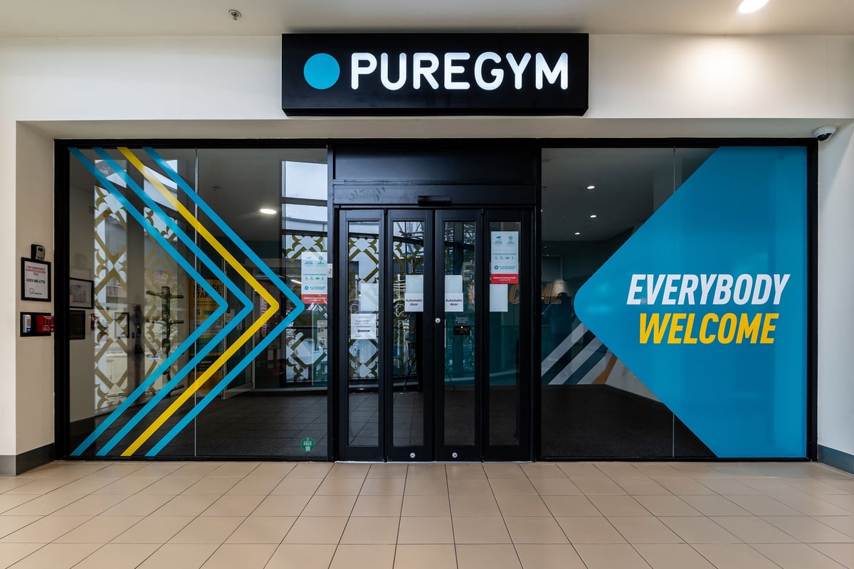 PureGym Ipswich Buttermarket: Entrance to a gym with signage "PUREGYM" and "EVERYBODY WELCOME" visible.
