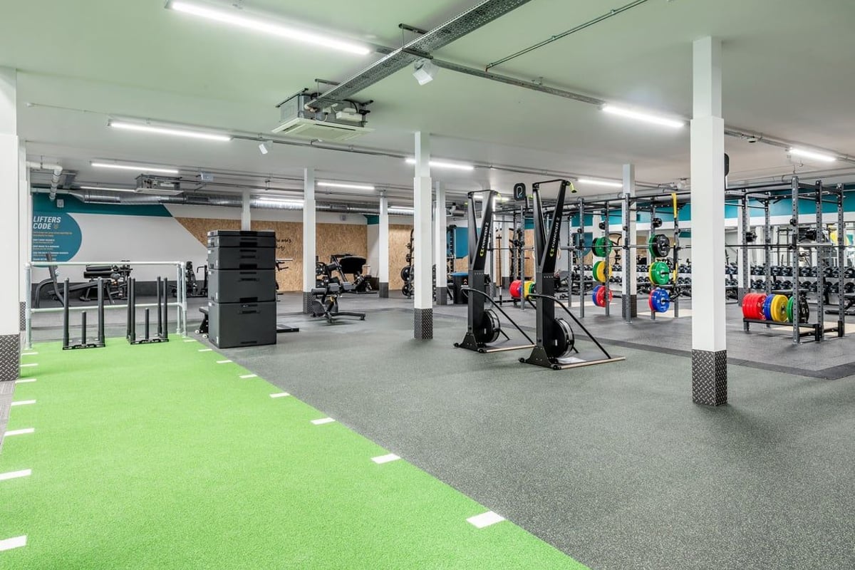 PureGym Cannock Orbital Retail Park: Weight racks, resistance machines, free weights, benches and turf area.