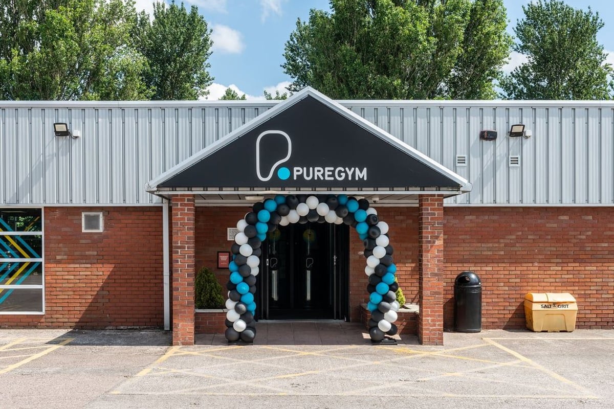 PureGym Northwich: Gym entrance decorated with colourful balloon arches over the doors.