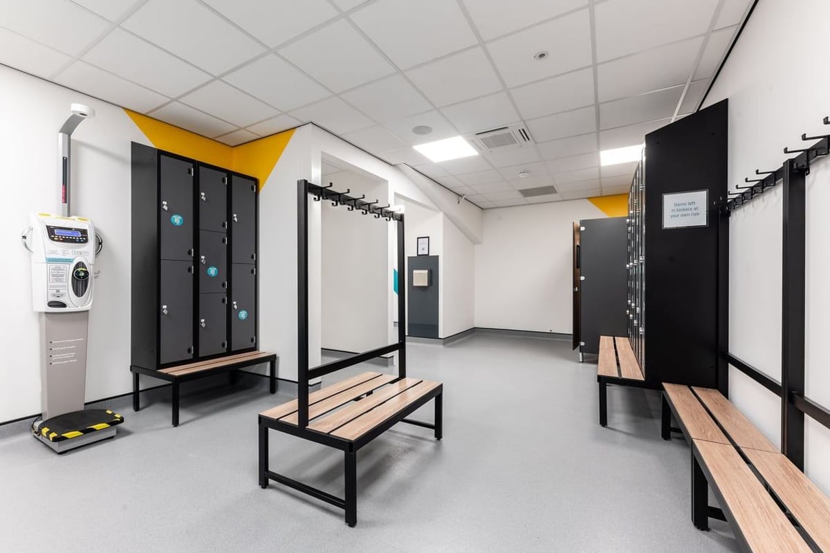 PureGym Dagenham: Rows of lockers, benches, and storage cubbies for gym belongings.