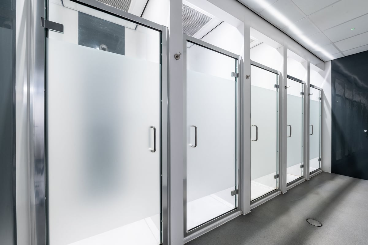 PureGym Peterborough Serpentine Green Shopping Centre: Shower area with frosted glass doors.