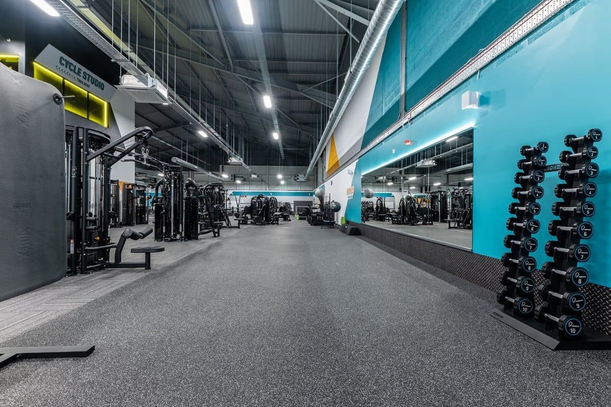 PureGym Sheffield Meadowhall Retail Park: Gym area with weight machines, free weights, benches, and rubberized flooring.