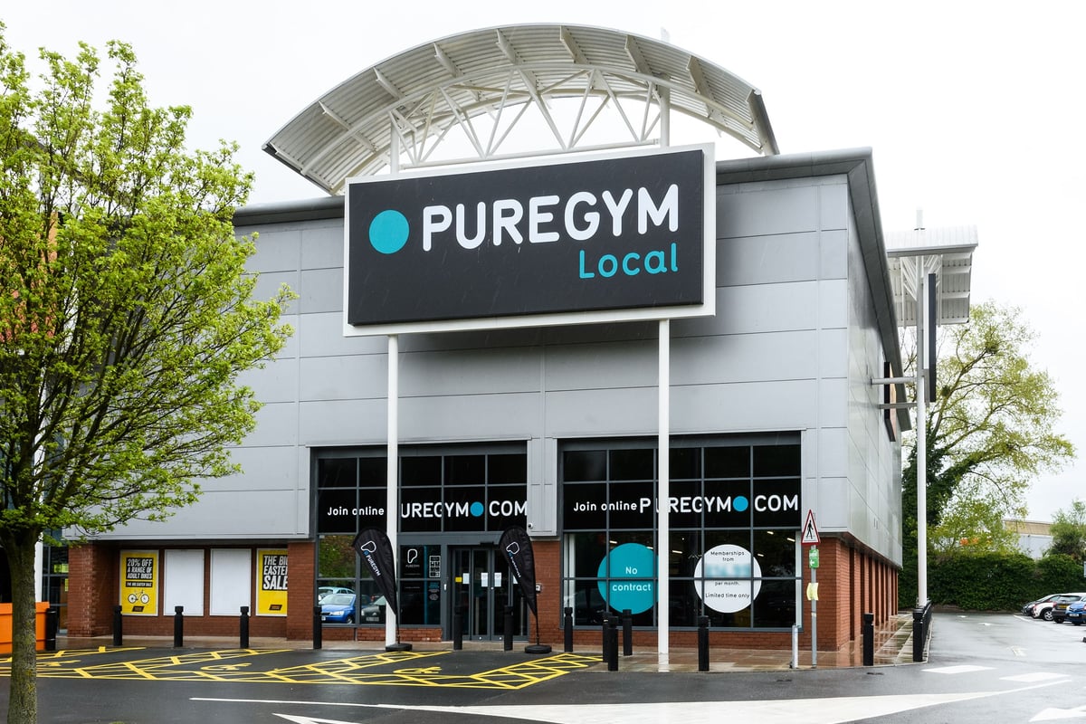 PureGym Hereford: Exterior of a Pure Gym building with signage, parking spaces, and entrance visible.