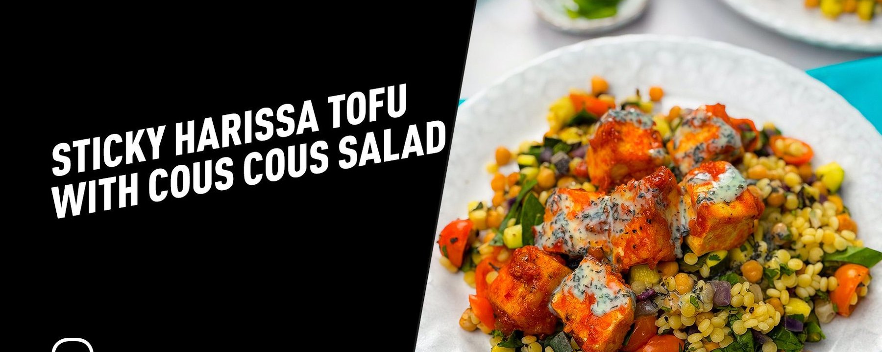 Sticky harissa tofu cubes on couscous salad with chickpeas and vegetables on white plates