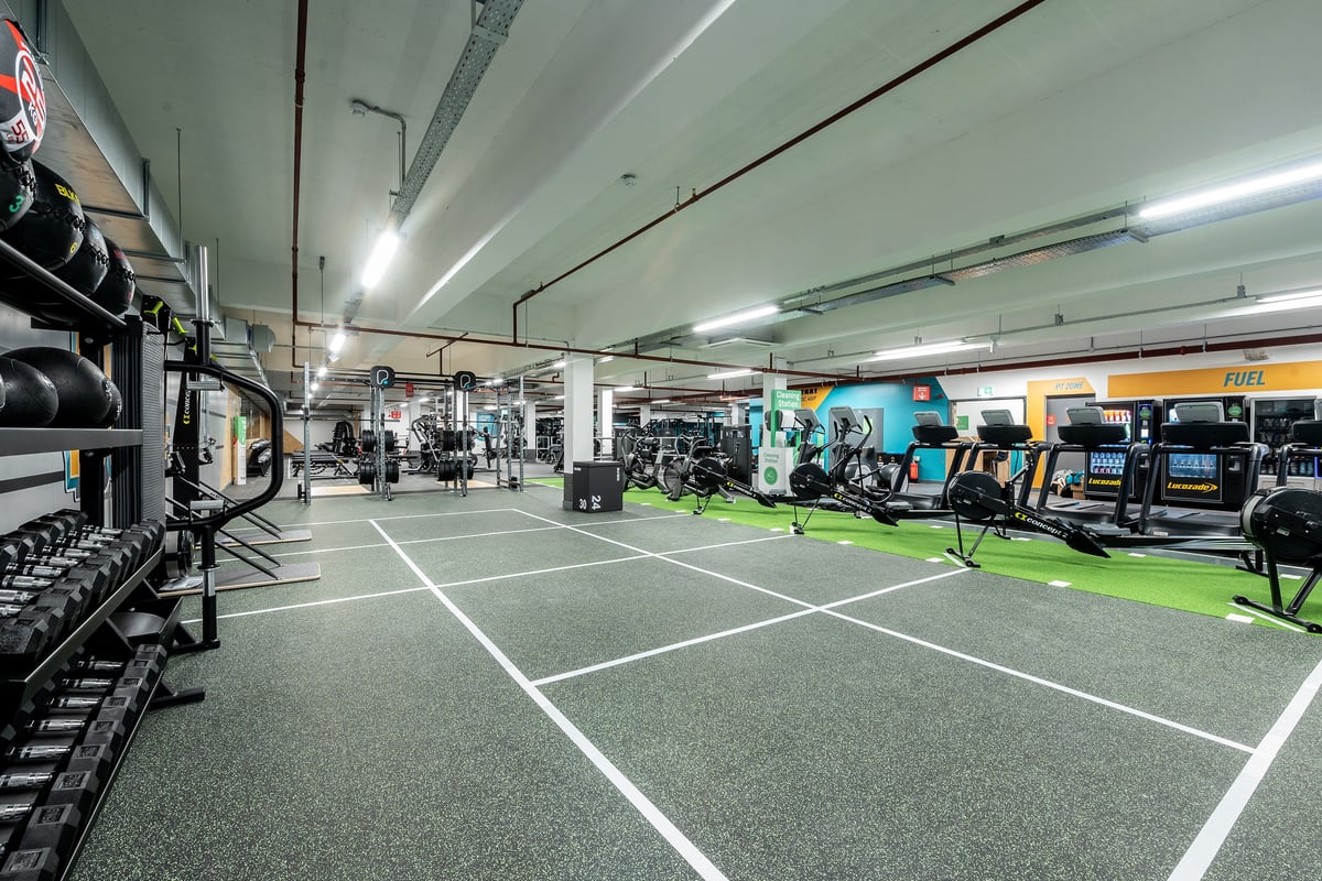 PureGym Gravesend: Weights, machines, turf area, mirrored walls in a brightly-lit gym or fitness centre.