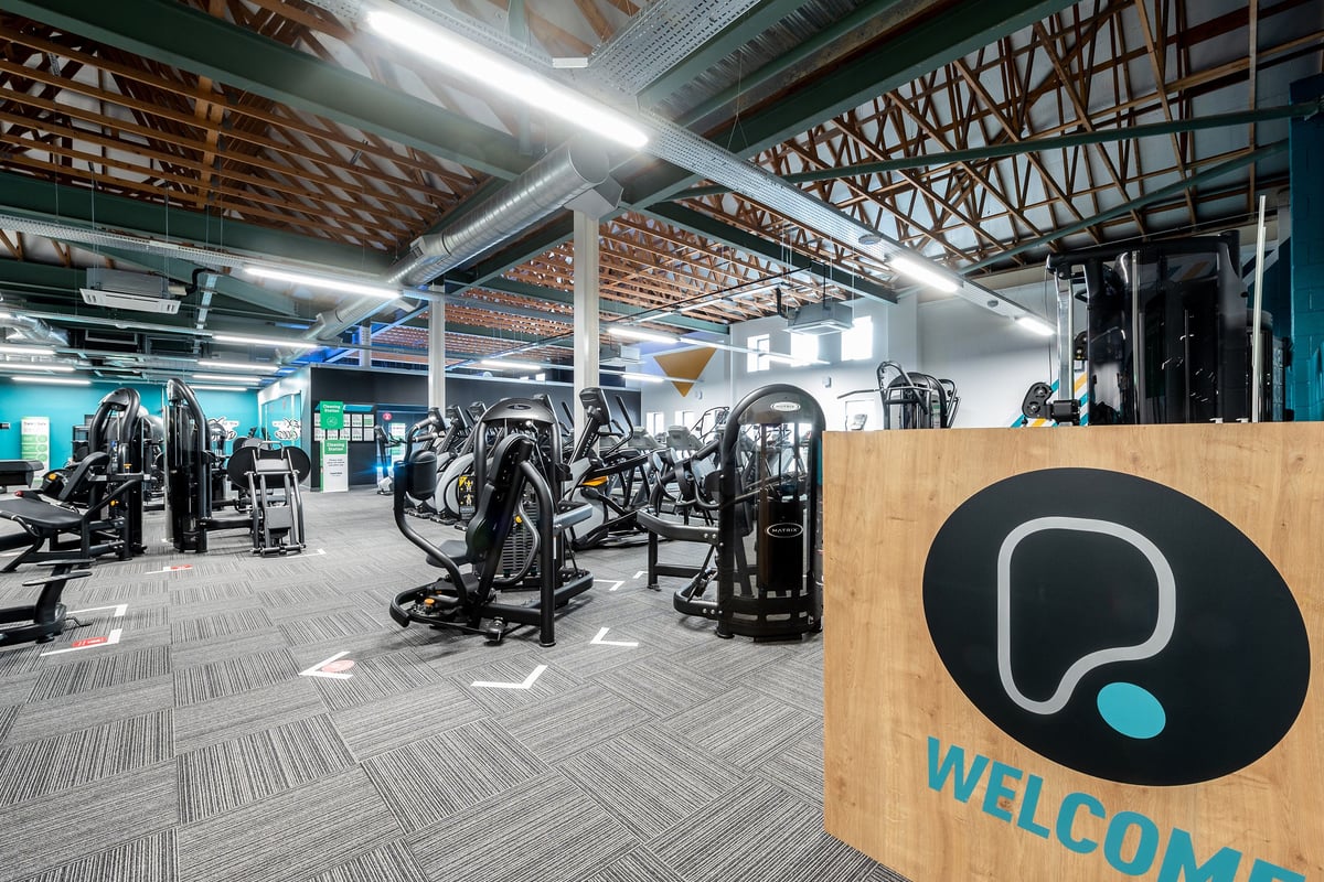 PureGym Chelmsford Meadows: Rows of weight machines, free weights, benches, and mirrored walls.