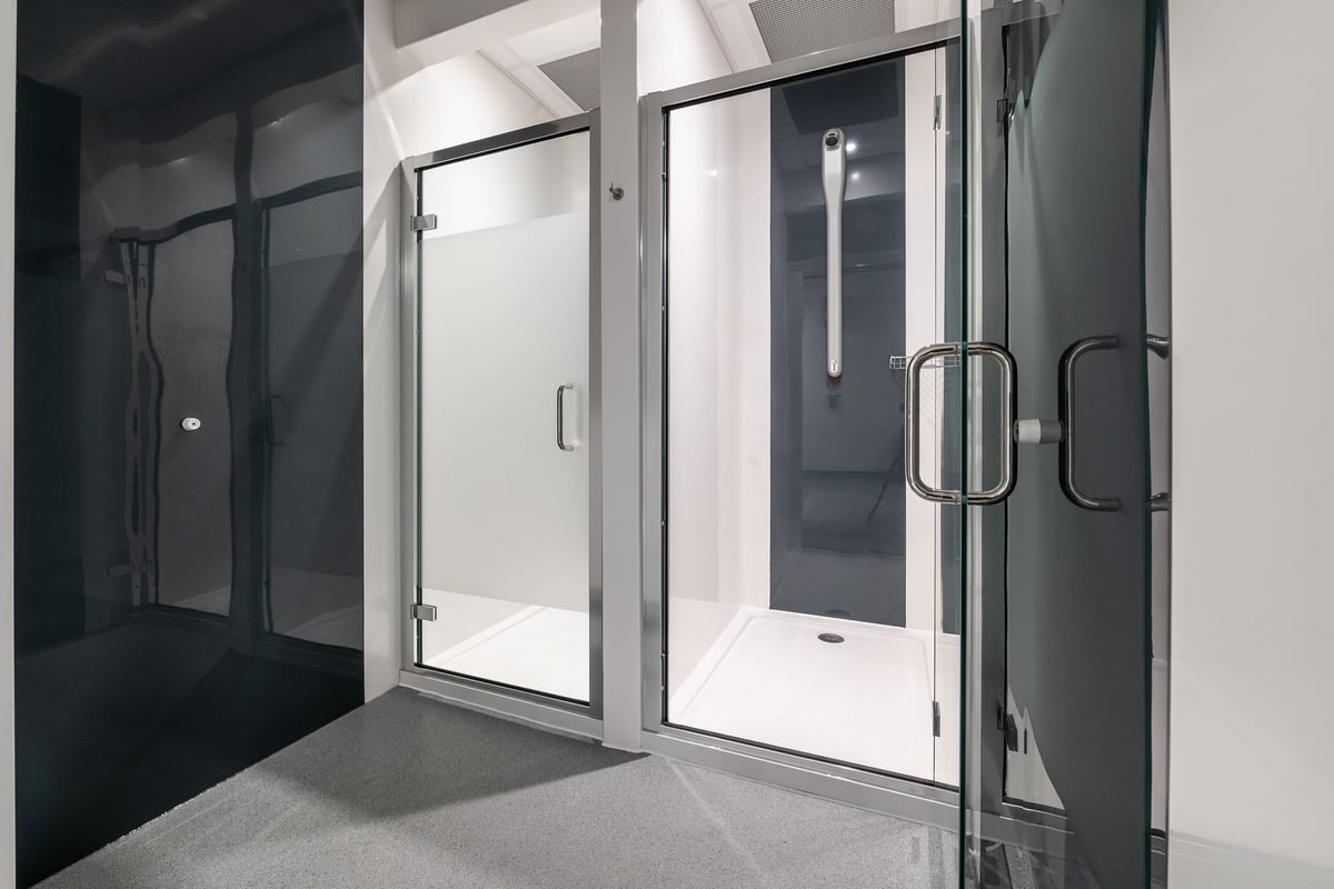 PureGym London Colney: Glass doors, chrome handles, leading to shower or changing rooms.