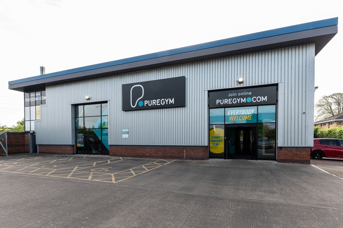 PureGym Leamington Spa: Gym exterior with signage, parking spaces, and entrance visible.