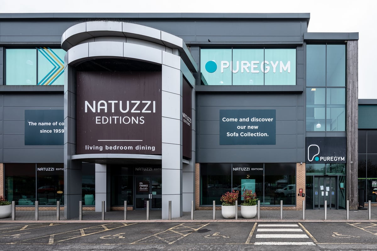 PureGym Cardiff Gate: Storefront of a furniture showroom and a gym exterior.