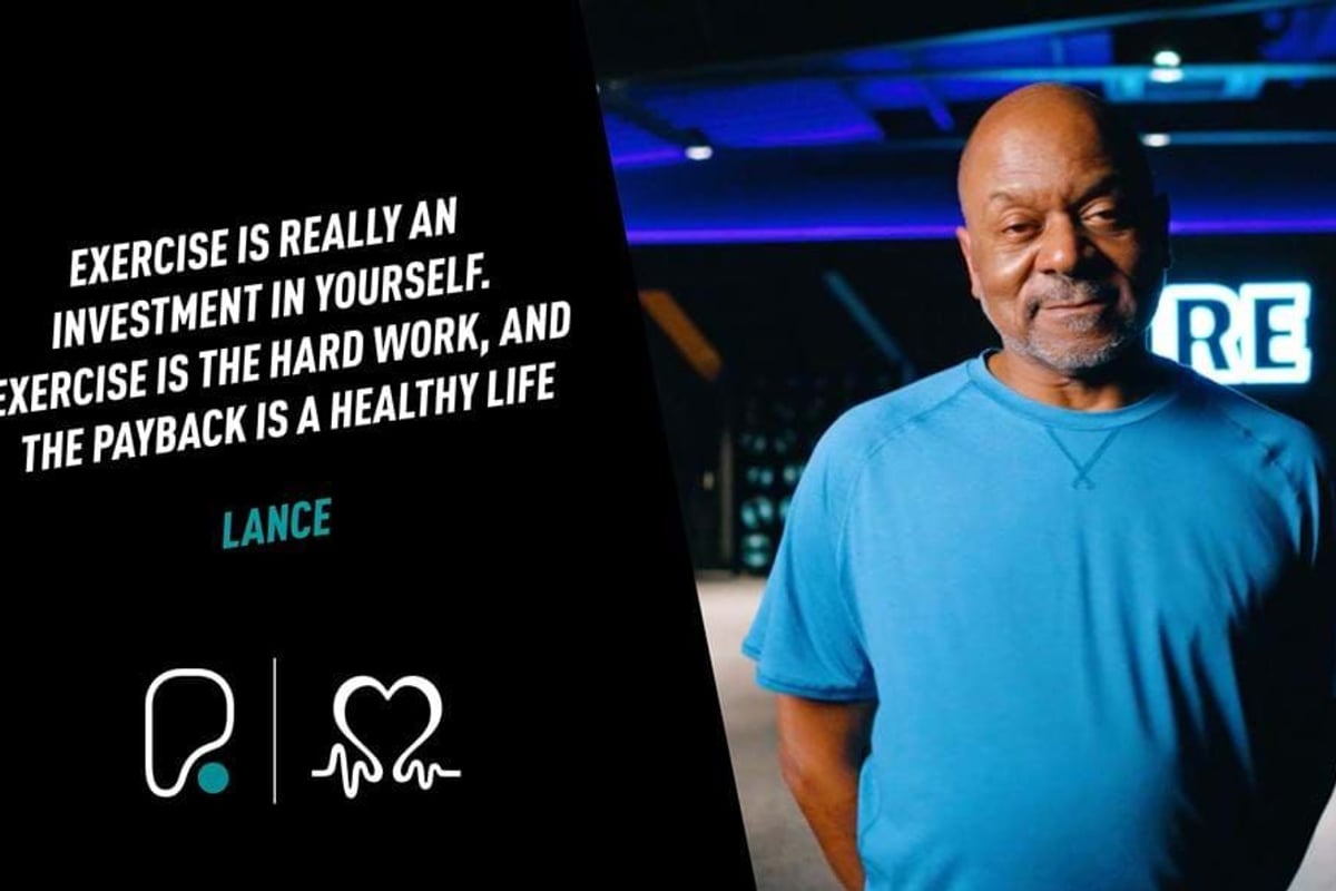 Man in blue t-shirt standing with a motivational exercise quote on a black background.