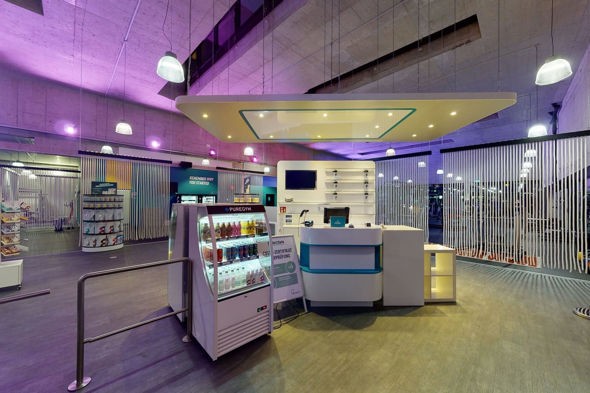PureGym Schlieren: Entrance turnstile, welcome signage, and drinks cooler.