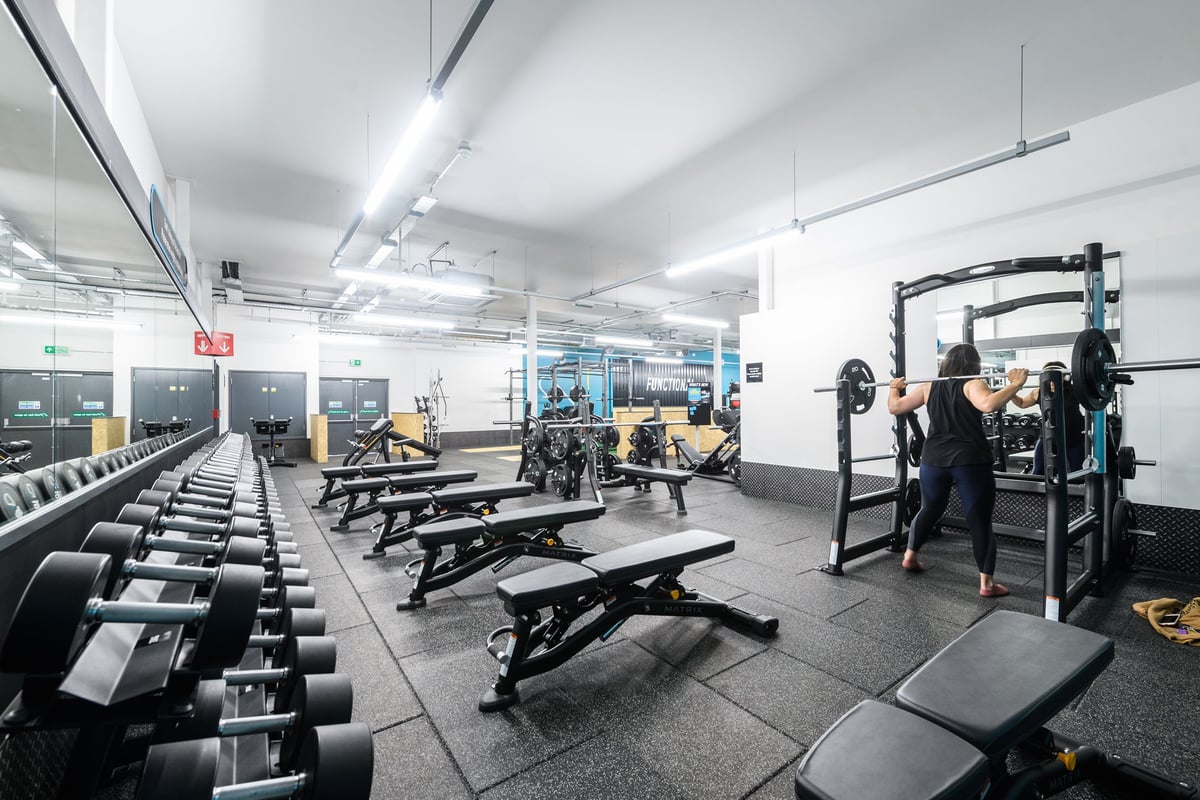 PureGym Hereford: Free weights, benches, squat racks, rubberized flooring in a spacious gym interior.