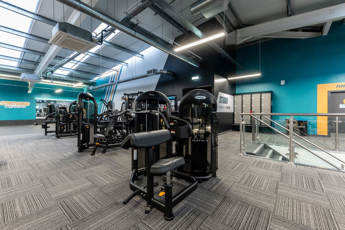 PureGym Solihull Sears Retail Park: Rows of weight machines, benches, and exercise equipment in a spacious gym interior.