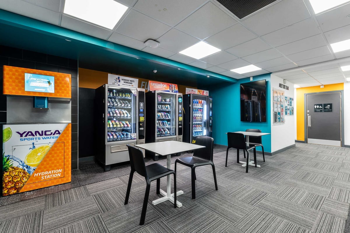 PureGym Canary Wharf vending machines and seating area