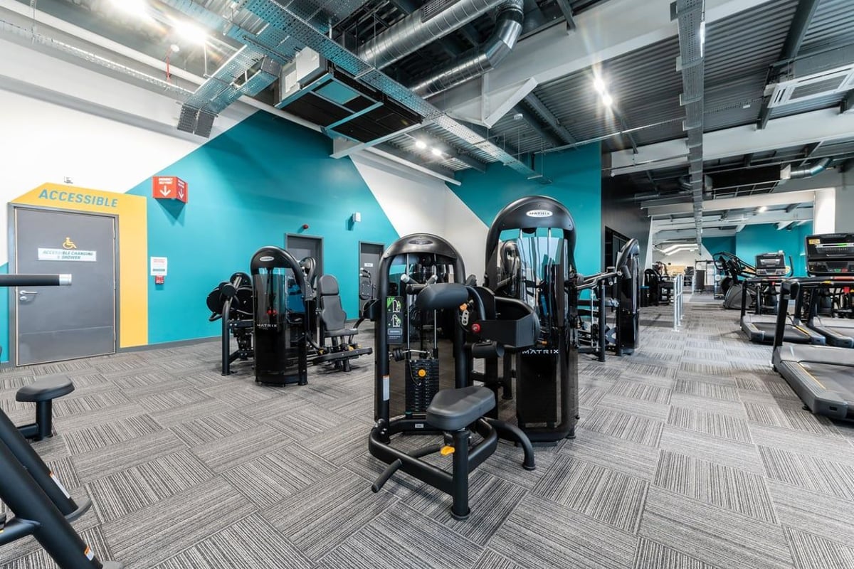 PureGym Bicester: Resistance machines, cable columns, weight stacks in teal and grey colour scheme.
