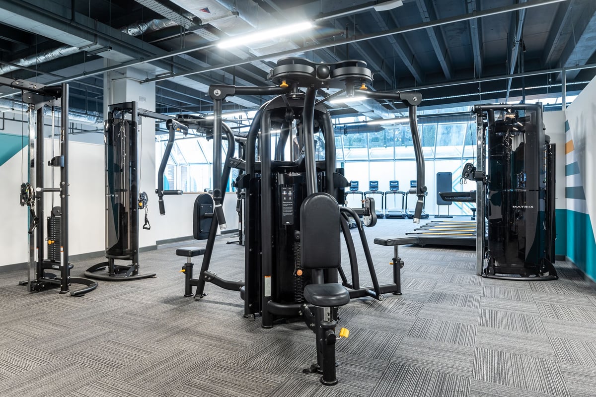 PureGym Ipswich Buttermarket: Fitness studio with weight machines, cable pulleys, benches, and rubberized flooring.