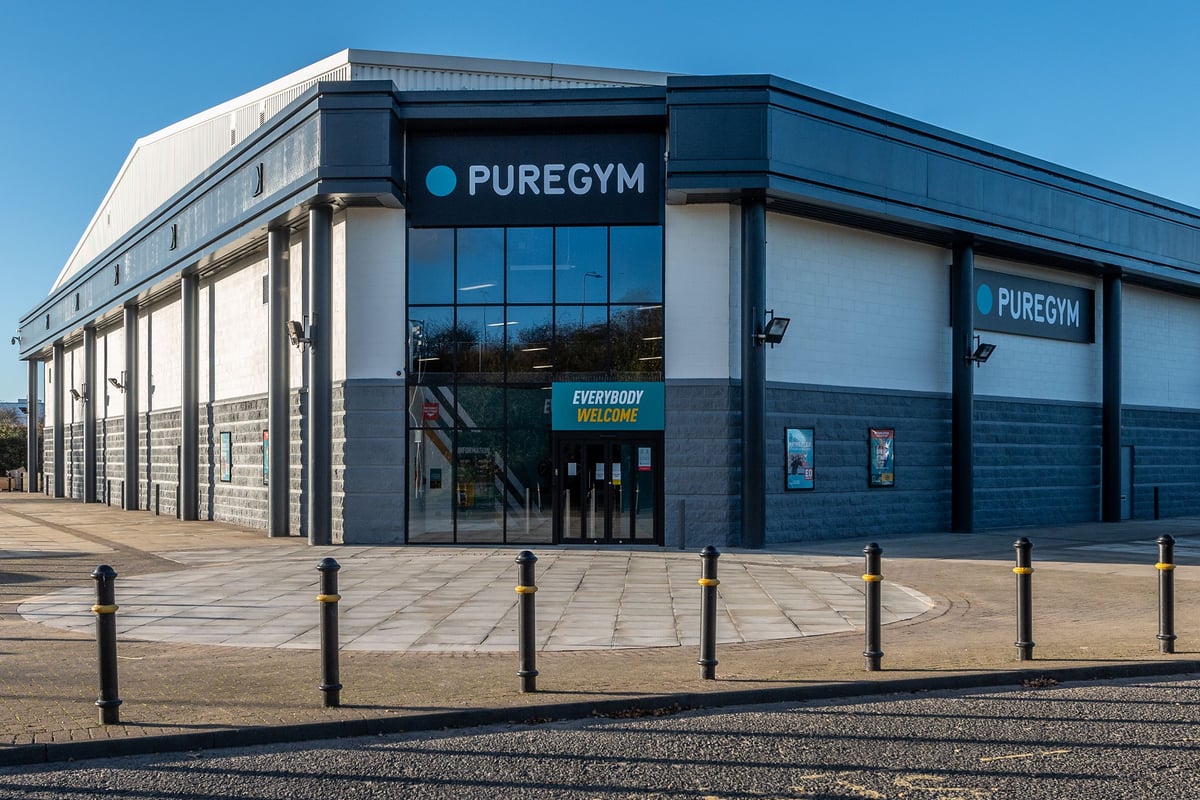 PureGym Stockton-on-tees Teesside Park: Modern gym exterior with tinted glass, stone facade, and PureGym signage.