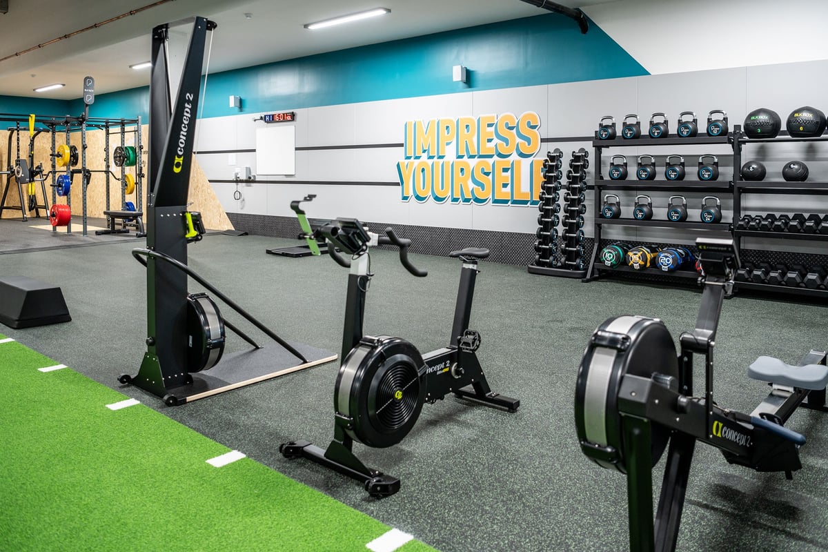 PureGym London Bethnal Green: Functional training rigs, assault bikes, weight racks, rubber flooring, turf area.