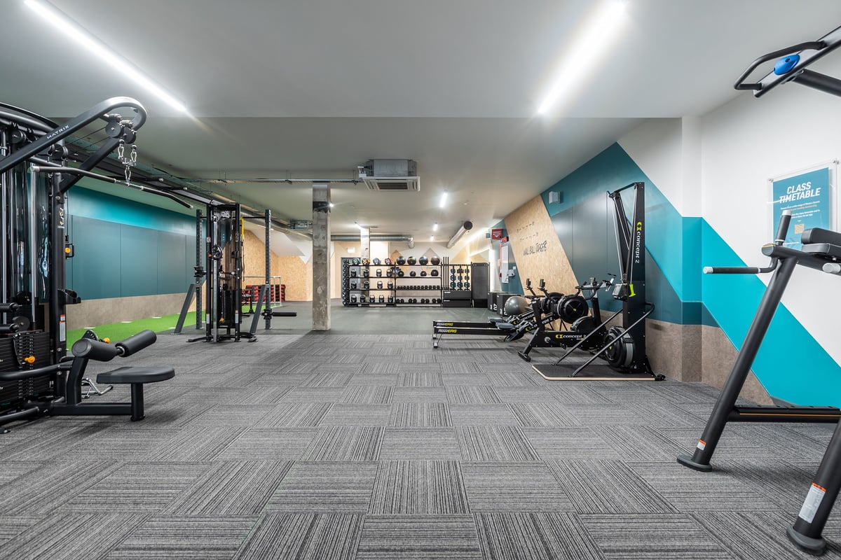 PureGym London Welling: Functional training area with cable machines, free weights, benches, and resistance bands.