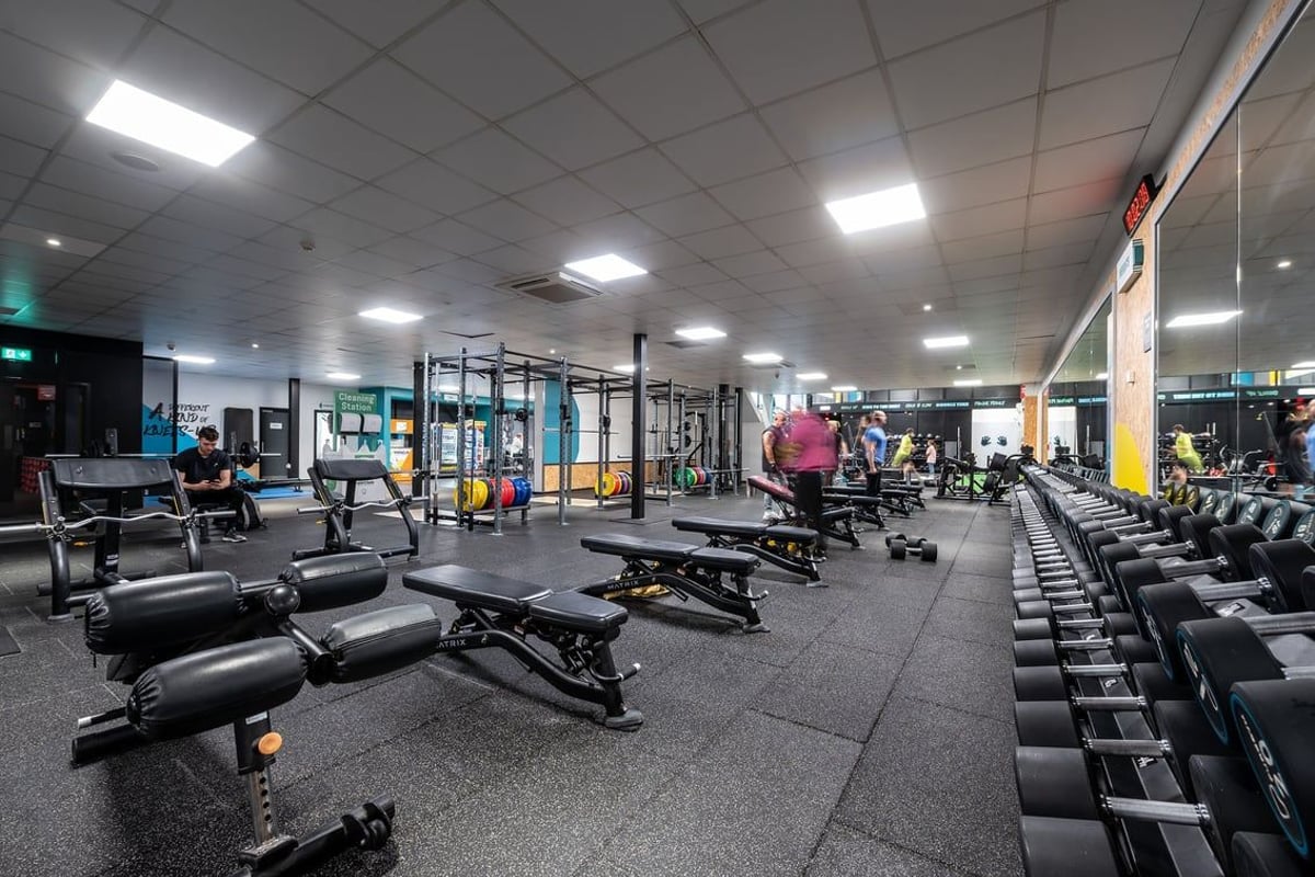 PureGym Southampton Central: Gym space with workout racks, benches, free weights, and rubberised flooring.