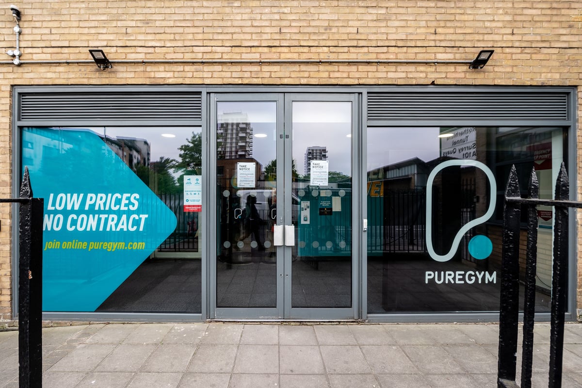 PureGym London Limehouse: Gym exterior with glass doors, brick walls, "Low Prices No Contract" advertised.