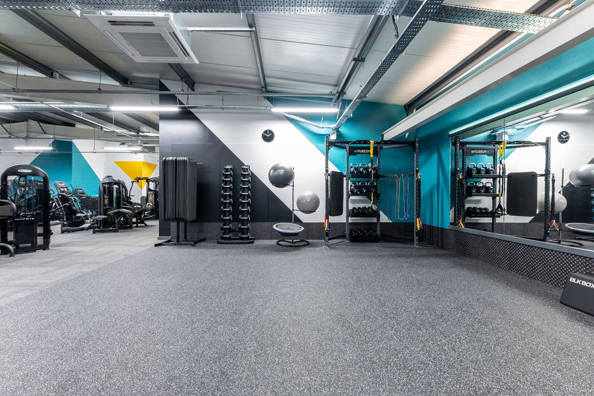 PureGym Sheffield Crystal Peaks: Gym studio with weight machines, free weights, resistance bands, and rubberized flooring.