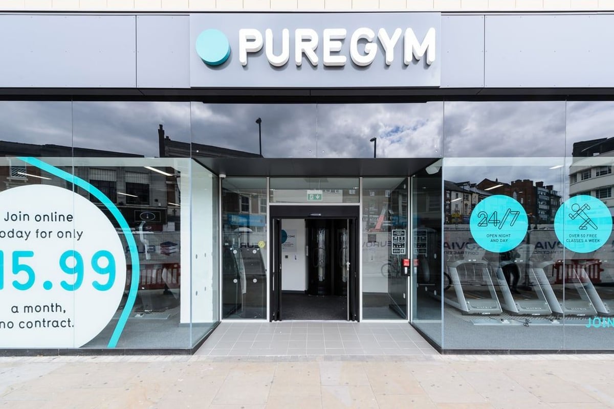 PureGym Derby City Centre: Gym exterior with teal branding, large windows displaying membership offer.