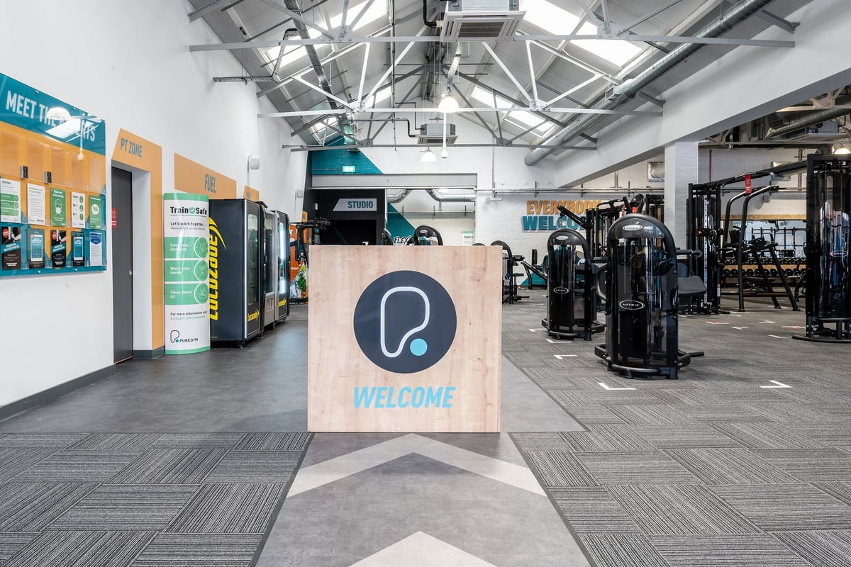 PureGym Puregym Crayford: Resistance machines, free weights, rubberized flooring, mirrors, and welcome signage.